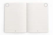Overhead view of DOT notebook refill pages 32 and 33 with ruled lines, page numbers and shortcut tag placement circles