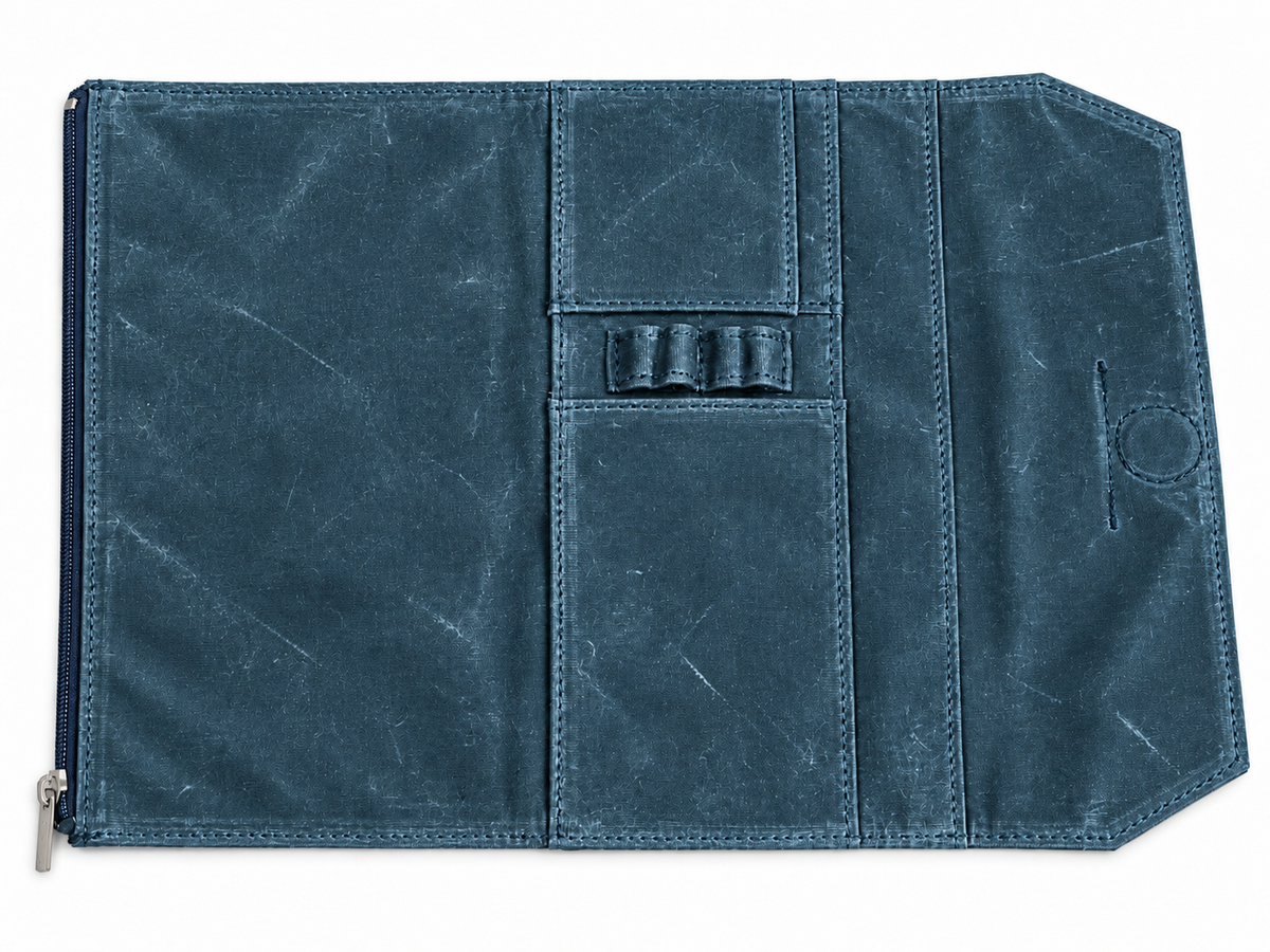 Studio Case waxed canvas pencil case in Glacier, open flat showing interior pen loops and card pocket