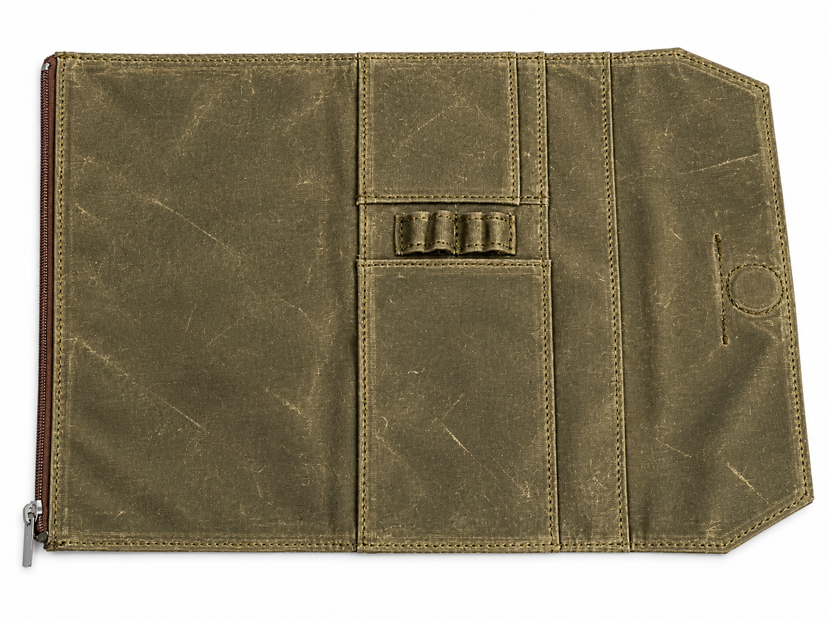 Studio Case waxed canvas pencil case in Spruce, open flat showing interior pen loops and card pocket