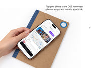 Tapping a phone to the DOT tag on a Glacier notebook cover to connect photos, songs, and locations