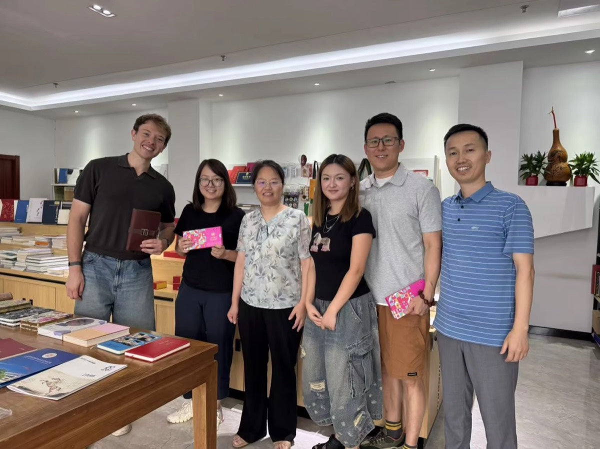 Meeting the manufacturing team in China, holding a DOT prototype and samples